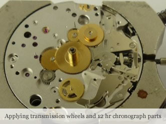 <p> Applying transmission wheels and 12 hr chronograph parts</p>